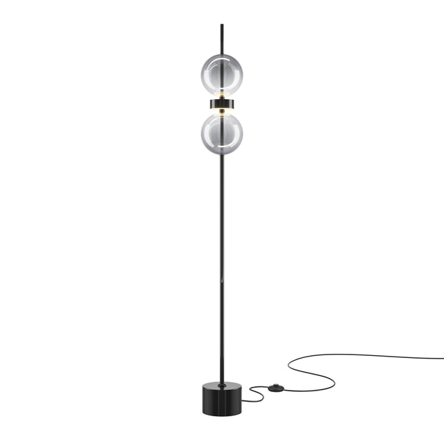 Maytoni Double Moon Ring LED floor lamp in black with two stacked smoked glass globes, brass-tone collars, and a cylindrical base with inline foot switch.