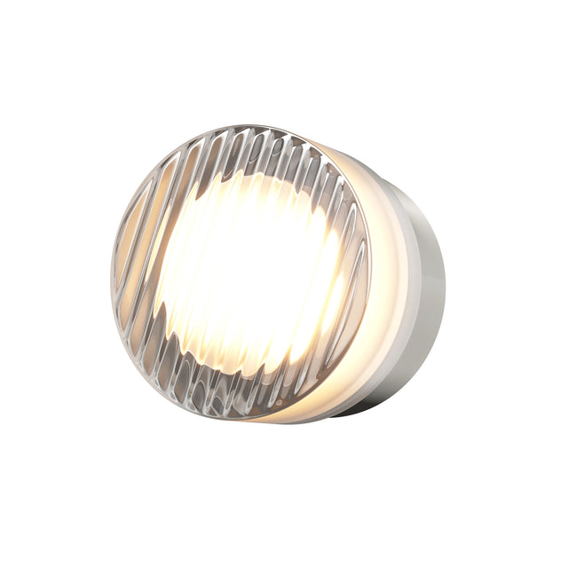 Maytoni Olo LED wall light with a circular ribbed glass disc and platinum-finish metal bezel, glowing warm white against a plain white background.