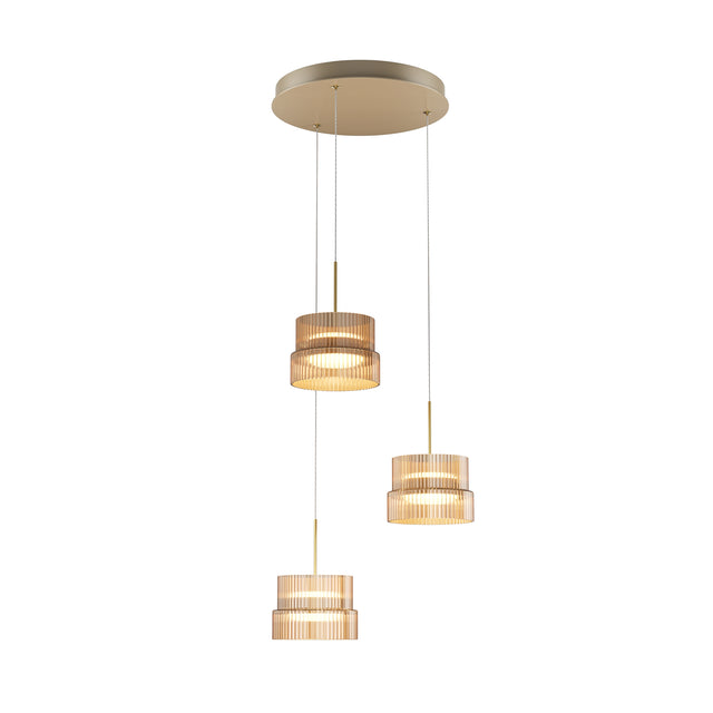 Maytoni Scala 3-light pendant with tiered ribbed amber glass shades staggered from a round bronze canopy, shown on a plain white background.