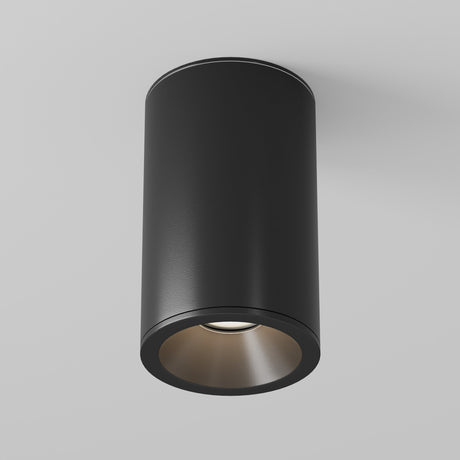 The Zoom Small Round Surface Downlight - Black features a sleek matte finish and soft-lit interior, with an IP65 rating for moisture resistance, set against a plain white background.