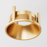 The Alfa LED Round Decorative Reflector Frame in matte gold features a hollow center with three vertical cylindrical prongs, evoking decorative lighting design. Its smooth, reflective surface stands out elegantly against a white background, reminiscent of an LED reflector.