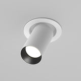 The Artisan Single Tilt Round Recessed Downlight in white is mounted in a gray ceiling. With its tilt mechanism, it casts a focused beam downward. Its sleek, modern design is complemented by durable aluminum construction.
