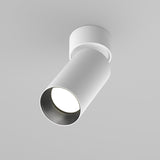 The Artisan Single Spotlight - White, with a textured finish, offers premium downward illumination for modern interiors from its ceiling-mounted cylindrical design.