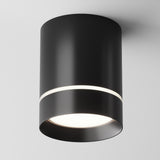 The Orlo LED Round Surface Downlight 9W 4000K in black features a sleek cylindrical design with an energy-efficient LED downlight. It has a narrow illuminated band at the top and a broader light source at the base, set against a plain white background.