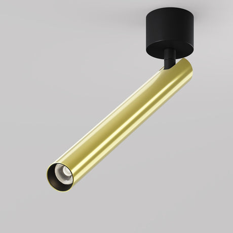 The Focus T LED Long Single Spotlight 6W 3000K features a sleek cylindrical black base and brass body. Its minimalist, angled design offers adjustable lighting, perfect for enhancing any space against a white backdrop.