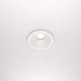 The Zoom LED Round Recessed Downlight 12W 4000K in white features a ceiling-mounted, minimalist design with a white circular frame and glowing center bulb. It has CRI 90, IP65 rating, offering sleek modern aesthetics against a white ceiling.