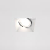 The Dot Single Tilt Plaster-in Square Recessed Downlight in white features a modern design with a clean finish. Its slightly angled structure allows adjustable light direction, offering focused illumination perfect for any contemporary space.