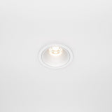 The Alfa LED Dimmable Fixed Round Recessed Downlight 10W 3000K in white casts a subtle glow on a smooth white ceiling.
