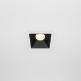The Alfa LED Fixed Square Recessed Downlight 10W 3000K features a black interior and is installed in a white ceiling, creating a modern two-tone look.