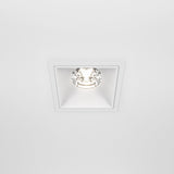 The Alfa LED Fixed Square Recessed Downlight 15W 4000K - White features a minimalistic design with a bright, circular LED bulb, blending seamlessly into modern interiors and spreading cool white light evenly across the ceiling.