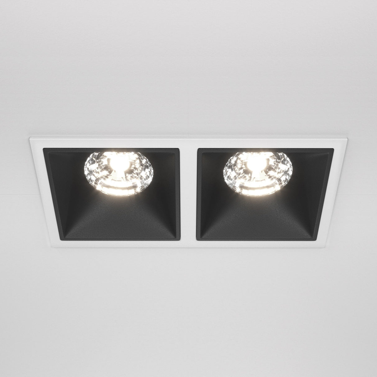The Alfa LED Twin Fixed Square Recessed Downlight 30W 4000K features a stylish two-tone design with black housings in a white rectangular frame, offering bright cool white illumination.