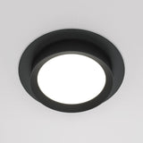 The Hoop Single Fixed Round Recessed Downlight in black offers a modern, minimalist design with an energy-efficient LED center that brightens light-colored ceilings with its vibrant glow.