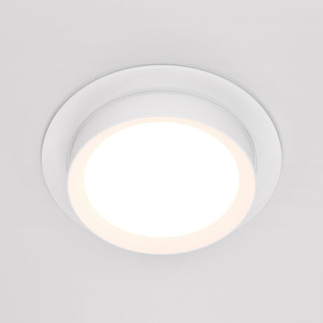 The Hoop Single Fixed Round Recessed Downlight - White is a sleek, circular fixture with a glowing center that stands out against a white background, providing an energy-efficient lighting solution.