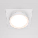 The Hoop Single Fixed Square Recessed Downlight in white is a modern circular LED ceiling light with a white square frame. It emits a bright, even glow, enhancing modern interiors and seamlessly blending with a plain white ceiling for a minimalist aesthetic.