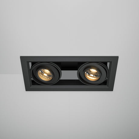 The Metal Modern LED Rectangular Recessed Twin Downlight 20W 3000K in black features two adjustable spotlights that emit energy-efficient LED lighting, creating a warm ambiance that contrasts beautifully against the white ceiling.