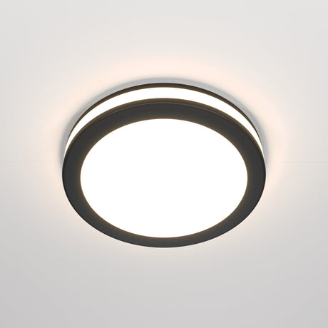 The Phanton LED Recessed Downlight 12W 3000K - Black features a modern, round black rim with a bright white center. Its minimalist design fits seamlessly on white ceilings, offering balanced illumination and a wide 120° beam angle for an elegant touch.