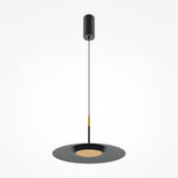 The El LED Round Tablet Pendant Light in black features a modern minimalist design with a cylindrical canopy, slim cable, round flat shade, and energy-efficient LED. The shades center is elegantly detailed with a circular, gold-colored texture.