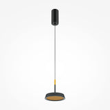 The El LED Round Tablet Pendant Light boasts a sleek black ceiling mount and cylindrical shade with a gold lining, suspended by a thin cord. This elegant and modern lighting piece enhances any interior with simplicity against a white background.