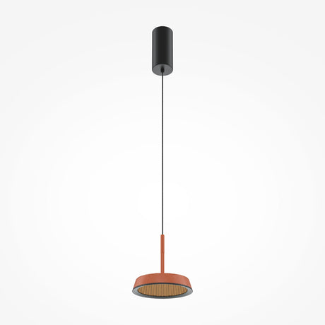 The El LED Round Tablet Pendant Light - Black & Terracotta showcases an industrial and artistic design with a black cylindrical ceiling mount, slim black cord, and terracotta circular shade. Its energy-efficient LED lights up elegantly against a white backdrop.