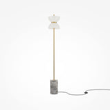 Meet the Kyoto LED Floor Lamp - Gold & Grey, a stunning piece with a thin gold pole, duotone shade, and cylindrical gray marble base. Inspired by Japanese design, it features an elegant black power cord for a chic look.