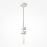 Check out the Kyoto Pendant Light - White & White Marble Base, a modern fixture with a minimalist vibe. It showcases a slim cylindrical bulb beneath two textured, bowl-shaped elements, all suspended by a white cord from a round ceiling canopy.