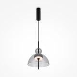 The Bangkok LED Pendant Light 25cm features a sleek design with a black rod, central glass sphere, and round grey glass shade. It hangs elegantly from a black cylindrical attachment against a white background, ideal for modern interiors.