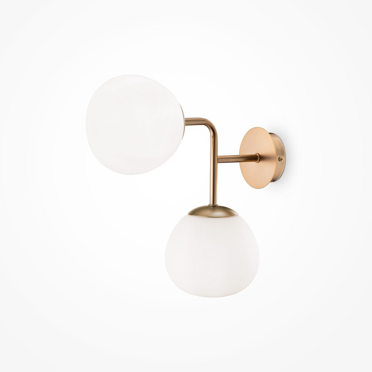 The Erich 2 Light Wall Light boasts a luxurious modern design, featuring a gold frame with two elegant arms. Each arm holds a frosted white glass globe shade on a circular brass base, all against a simple white backdrop.