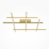 The Radiance LED Ceiling Light - Gold showcases a modern design with intersecting linear gold bars in a satin brass finish. It features three horizontal and two diagonal bars arranged in a rectangle, offering minimalistic, energy-efficient lighting against a white backdrop.
