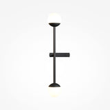 The Touch LED 4-Step Dimmable Wall Light in black features a minimalist design with a vertical rod and dual spherical bulbs. Its sleek functionality is enhanced with black metal fittings against a light gray background, providing efficient 3000K, 10W lighting.