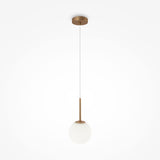 The Basic Form Globe Pendant Light features a frosted white 15cm glass sphere suspended from a thin cord attached to a circular brass ceiling mount and rod, perfect for modern interiors on a plain white background that accentuates its minimalist design.