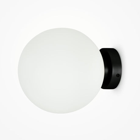 The Basic form Big Frosted Ball Wall Light - Black features a modern design with its frosted glass shade and sleek black base. Its minimalist style beautifully contrasts a plain white background, offering an ideal blend of elegance and simplicity.