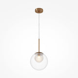 The Basic Form Globe Pendant Light 20cm in gold combines modern elegance with frosted and clear spherical glass, showcasing a visible bulb. Its suspended from the ceiling by a thin adjustable rod, perfect for versatile lighting against a plain white background.