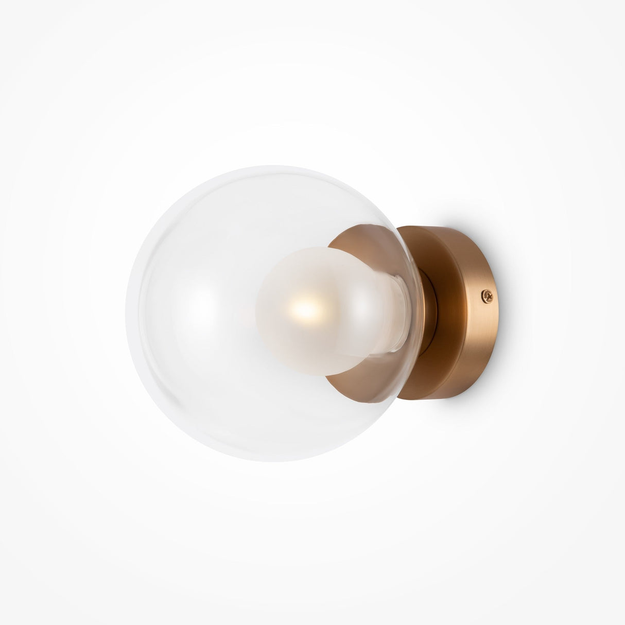 The Basic form Small Clear Ball Wall Light - Gold boasts a clear glass globe with a frosted bulb, elegantly mounted on a gold base for a sleek, sophisticated look.