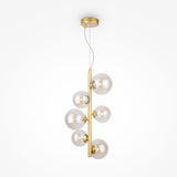 The Dallas 6 Light Drop Suspension features a modern design with gold rods, six asymmetrically arranged amber mirrored glass spheres, and transparent bulbs. Hanging elegantly from thin wires against a white background, its height is adjustable for the perfect fit.