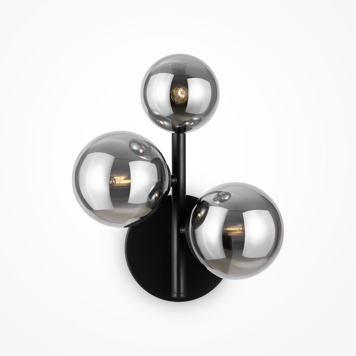 The Dallas 3 Light Wall Light - Black with Smoked Mirrored Glass features three round glass globes on sleek black metal stems, showcasing visible bulbs. It complements modern interiors beautifully, especially against a plain white background.