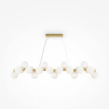 The Dallas 25 Light Linear Suspension showcases modern lighting with white glass globes meticulously aligned on a gold fixture, elegantly suspended from a rectangular ceiling mount.
