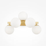 The Dallas 5 Light Wall Light - Brass With White Opal Glass showcases a minimalistic design with five globe bulbs in an arch, mounted on a sleek rectangular brass base for modern sophistication.