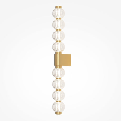 The Amulet LED Vertical Wall Light features a gold frame with ribbed glass spheres. The textured spheres create a stunning effect as the square gold backplate mounts it evenly, providing balance to the elegant design.