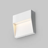 The Mane Outdoor LED Square Wall Light – White, featuring a minimalistic, rectangular design, emits a soft glow against a plain gray background.