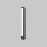 The Hof LED Pedestal Light 60cm in Graphite is a modern, minimalist rectangular fixture with a dark frame and bright white light panel against a neutral gray background. Ideal for outdoor lighting, it radiates a soft glow, showcasing its sleek and simple design.