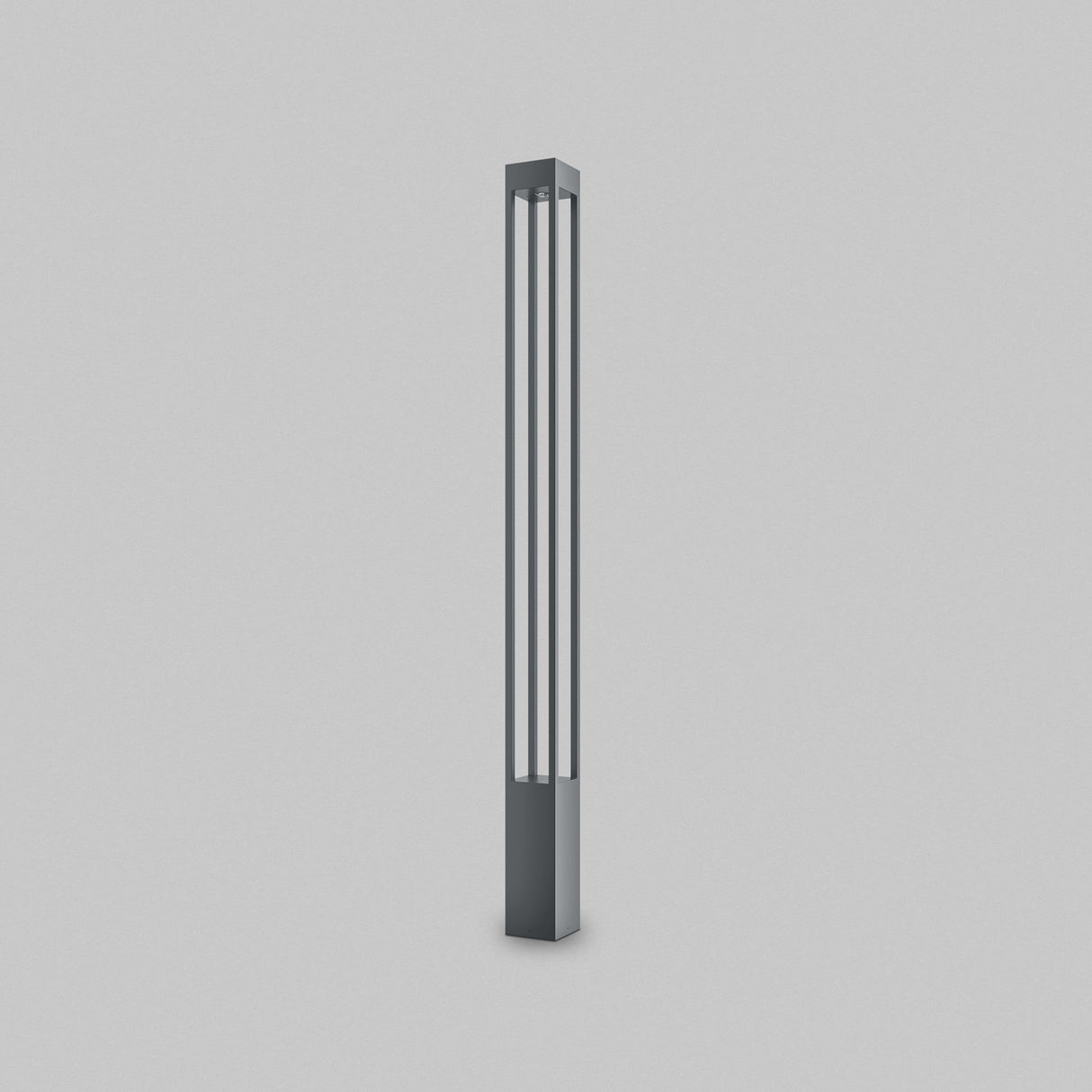 The Elbe Bollard Light 150cm in Graphite is a sleek, modern floor lamp with a tall rectangular shape. Featuring two vertical slits for soft white illumination, its contemporary metallic finish adds elegance to any setting, gracefully enhancing a plain white backdrop.