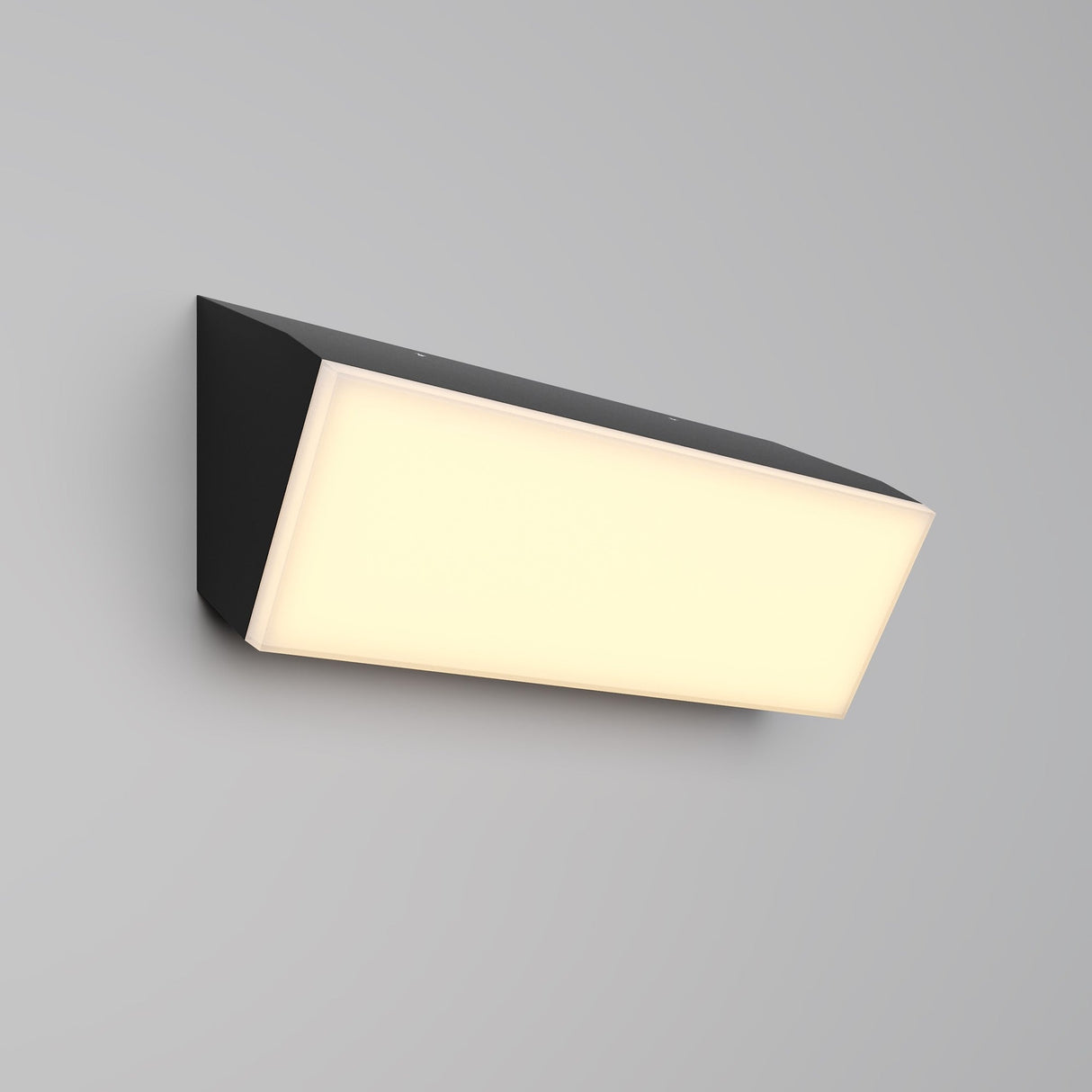 The Brick Outdoor LED Wall Light - Graphite (O436WL-L20GF3K) features a wall-mounted rectangular design with a graphite finish and frosted white diffuser, providing energy-efficient, soft, even illumination against a plain gray background.