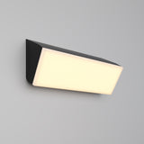 The Brick Outdoor LED Wall Light - Graphite (O436WL-L20GF3K) features a wall-mounted rectangular design with a graphite finish and frosted white diffuser, providing energy-efficient, soft, even illumination against a plain gray background.
