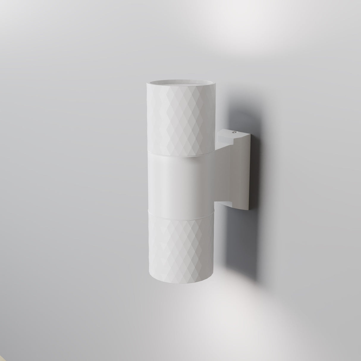 The Bowery Outdoor 2 Light Wall Light (O583WL-02W) in white features a cylindrical design with a textured surface, mounted on a light gray wall. This corrosion-resistant fixture emits light from the top and bottom, providing soft illumination for modern exteriors.