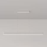 The Step LED Long Linear Suspension Light 3000K 30W - White, with its minimalist and modern design, hangs from the ceiling by two thin wires against a plain white backdrop. It features advanced SMD LED technology for efficient illumination.