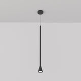 The Arrow 1 Light Long Cone Pendant in black features a minimalist design with an elongated, conical shape. It hangs from a white ceiling, emitting a subtle glow and adjustable in height for versatile placement.
