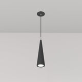 The Nevill Conical Pendant Light - Black hangs elegantly with a sleek cone shape and matte black finish. Its minimalist design includes a thin cord connecting it to a round base, casting a soft, focused downward glow.