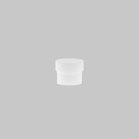 A small, white cylindrical container with a lid rests on a plain gray background, similar to the Focus LED Light Diffuser Small 5W for glare-free lighting.