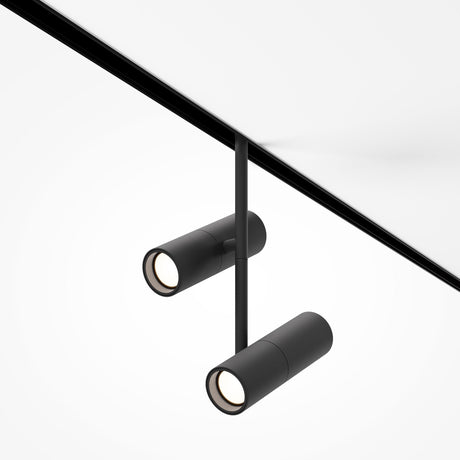 The minimalist Elti Duo CCT Spotlight 24W in black features dimmable LED lights on a sleek diagonal rod, mounted against a white background.