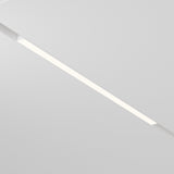 A modern ceiling incorporates the Basis LED Linear Light for Magnetic Track Exility 24W 3000K - White, offering a warm ambient glow embedded in a white surface, delivering a clean and minimalist look to the space.